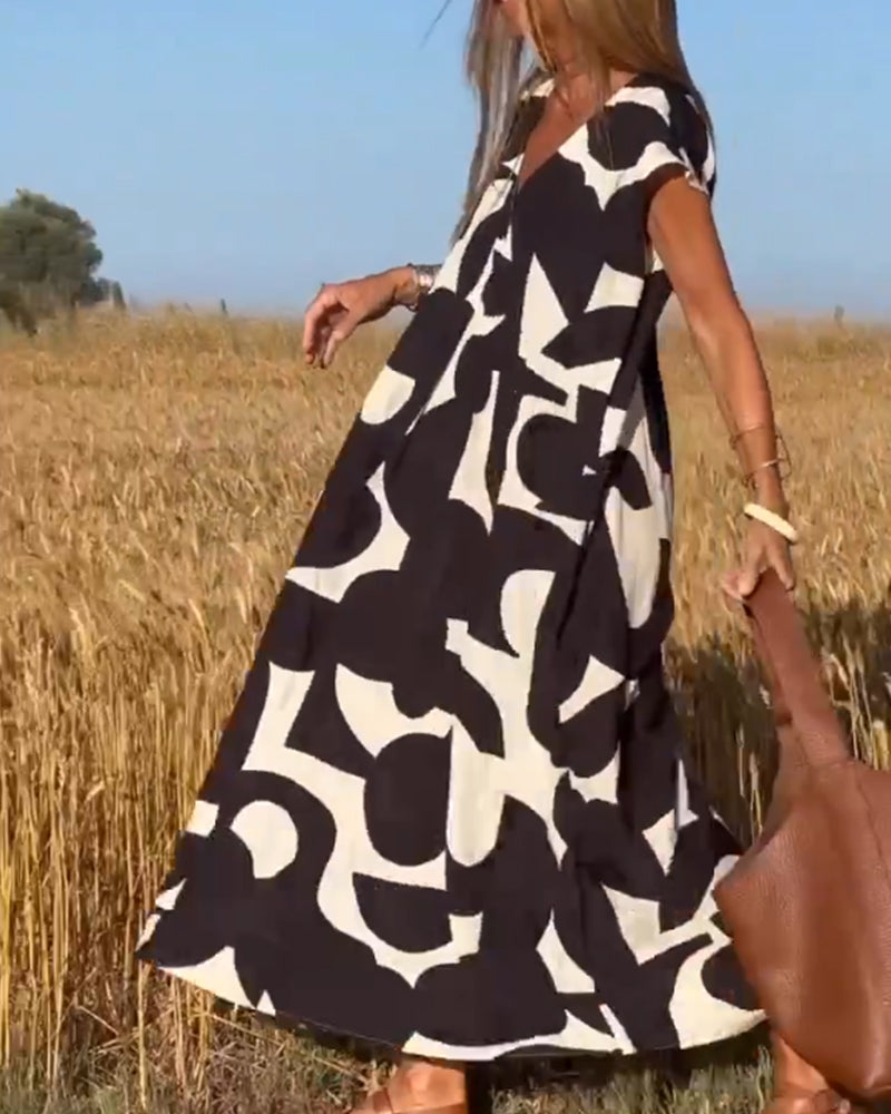 Elowen - Unregelmäßiges ärmelloses Kleid mit geometrischem Druck