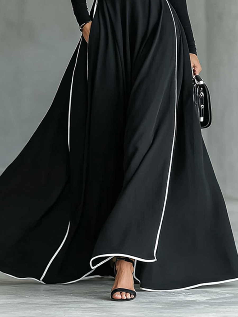 Vestido Maxi Preto com Costuras Brancas, Gola Subida, Mangas Compridas e Corte Justo
